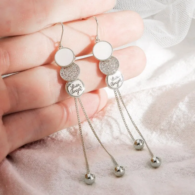 silvriga_three_disc_long__1.webp Silvriga Three Disc Long Tassel örhängen<VSmycken Online